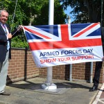 East Sussex County council chairman Cllr Colin Belsey, with chief operating officer Kevin Foster, raises the flag at County Hall to mark Armed Forces Day