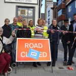 Cllr Rosalyn St Pierre (fifth from right), Cllr Ruth O’Keeffe (third from right) and Mark Valleley, East Sussex County Council team manager for infrastructure and delivery (far right), with local traders and workers from scheme contractors Kier, on completion of works in Station Street, Lewes