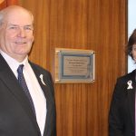 Cllr Keith Glazier, East Sussex County Council leader, and Becky Shaw, county council chief executive, unveil the White Ribbon plaque at County Hall