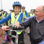 Cllr Nick Bennett and child from Tollgate Junior School, Eastbourne, at launch of Horsey Way