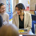 The Duchess of Sussex with UK Youth Cabinet member Indya Wardle and a copy of the Top Ten Tips mental health guide for schools during the visit to Peacehaven