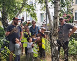 group of adults and children litter picking