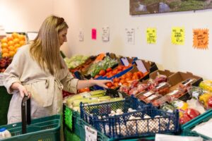 pregnant woman browsing fruit and vegetables