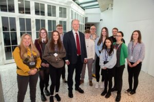 Professor Chris Whitty and Darrell Gale with young people and reps from schools and colleges