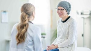 patient and a nurse sitting talking