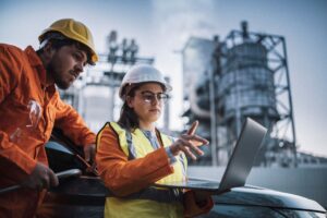 young girl working with an engineer on a construction site 