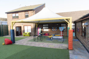 outdoor area showing covered play area and toys